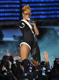 th_59229_celebrity-paradise.com-The_Elder-Rihanna_2010-02-04_-_Pepsi_Super_Bowl_Fan_Jam_in_Miami_759_122_114lo.jpg