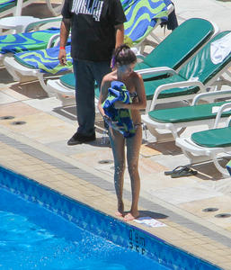 th 800465813 Celebutopia netSelenaGomez15 122 430lo Selena Gomez gets a Brazilian tan while at a pool at her hotel in Rio 2 4 12 x36